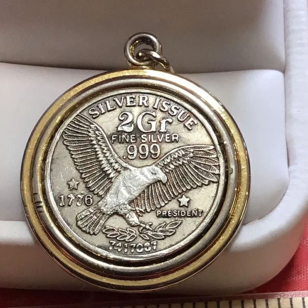 Vintage two gram silver issue 999 Eagle pendant